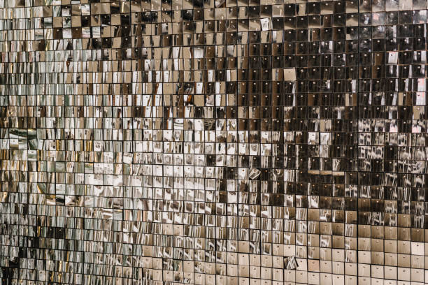istock Space with flickering and glittering metallic particles. Wall is made of square glittering sequins. Silver glitter sparkles on background. Decor and interior decoration. Place for text. Closeup. 1713221094