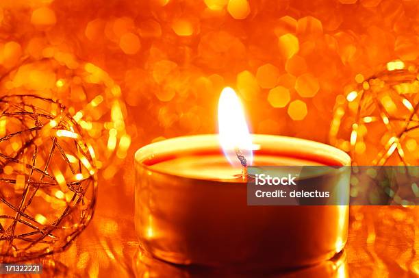 Candle On A Blurred Lights Background Stock Photo - Download Image Now - Burning, Candle, Candlelight