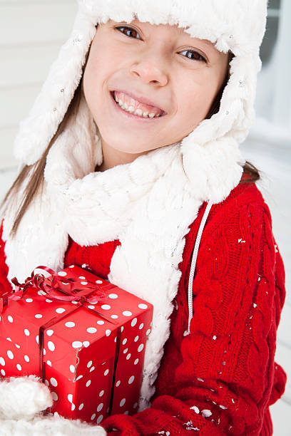 istock Young girl holding a present 171322276