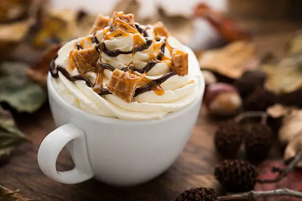 Photo of Hot drink with Cream, Caramel Waffle pieces and Chocolate sauce
