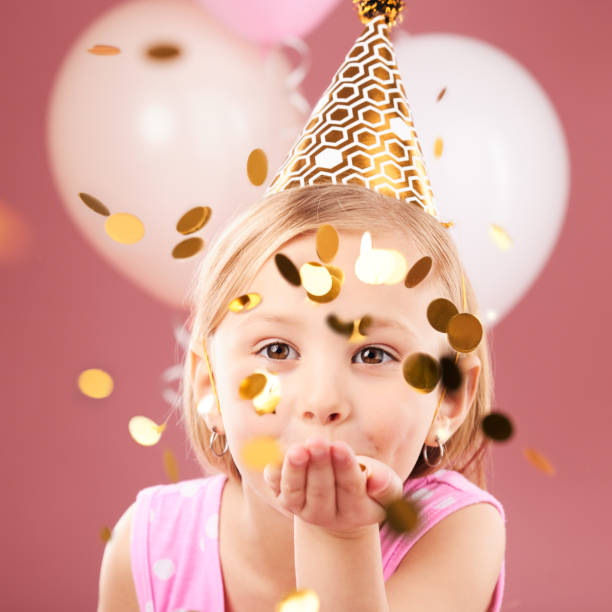 balloons, birthday and portrait of girl with confetti on pink background for party, celebration and special day. happy, excited and young child with decoration for magic, wonder and glitter in studio - celebration inflatable excitement concepts imagens e fotografias de stock