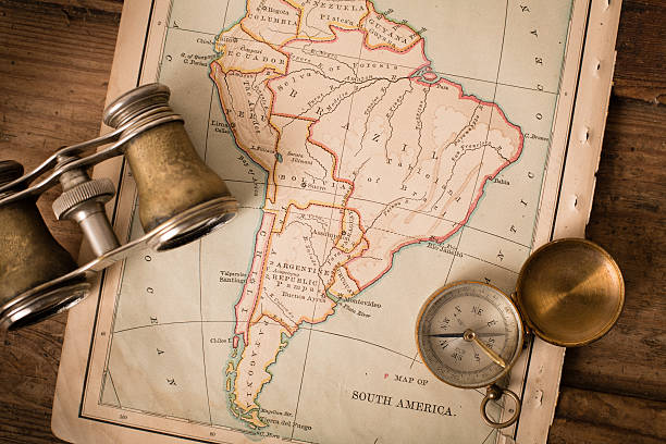 Antique 1870 Map of South America, Binoculars, and Compass "Close up, color image of an old map of South America, from the 1800's, with binoculars and a compass, on wood background.  Map is from an old geography book with an 1870 copyright." topographic map photos stock pictures, royalty-free photos & images