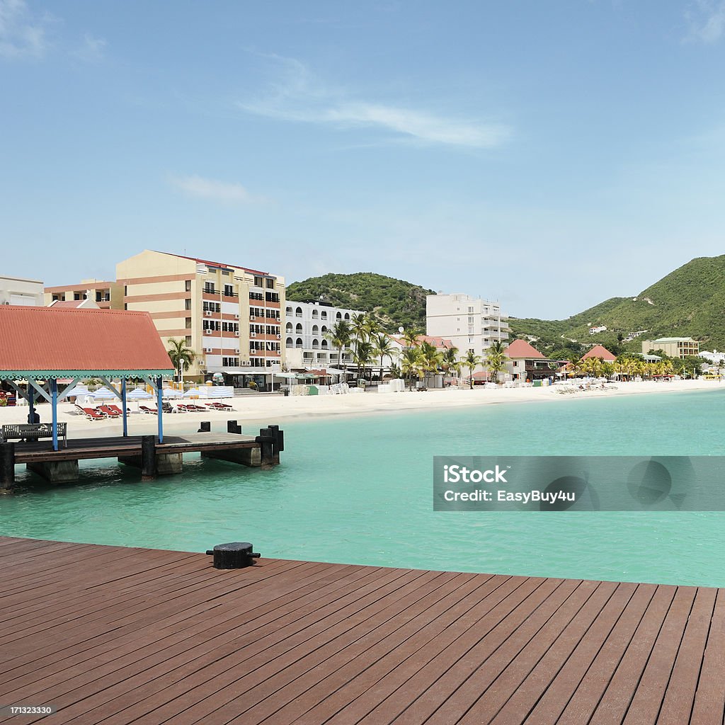 Carribean beach "Carribean beach in Philipsburg, St Martin (Dutch side) with hotels, restaurants and stores view from a quay, square picture. Clic on pictures below for more St Martin..." Sint Maarten Stock Photo