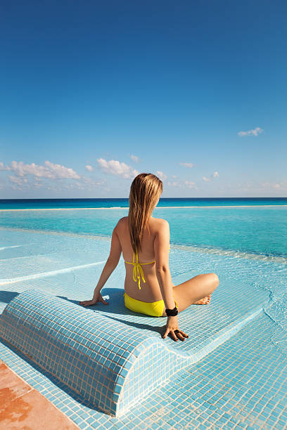 istock On Vacation Sunbathing and Relaxing in Infinity Pool Vt 171323546