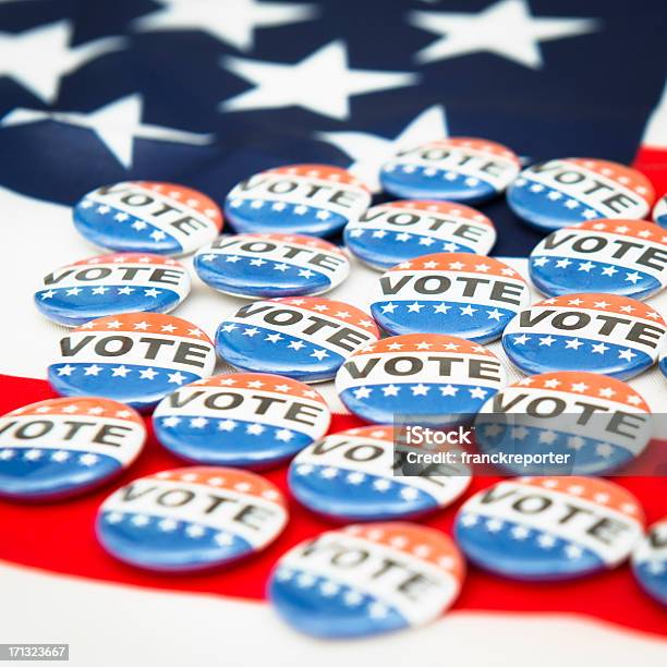 Vote Button For The 2012 Election Under Us Flag Stock Photo - Download Image Now - 2012, American Culture, American Flag