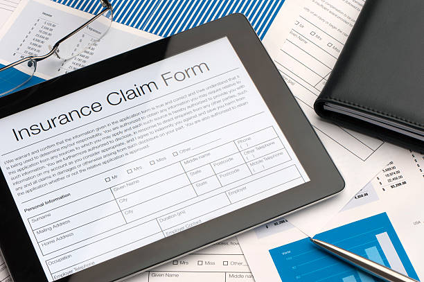 Online insurance claim form Online insurance claim form on a digital tablet claim form stock pictures, royalty-free photos & images