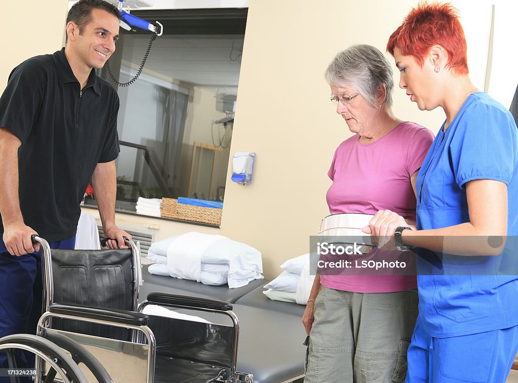 Physiotherapy - Help Senior 30-39 Years Stock Photo