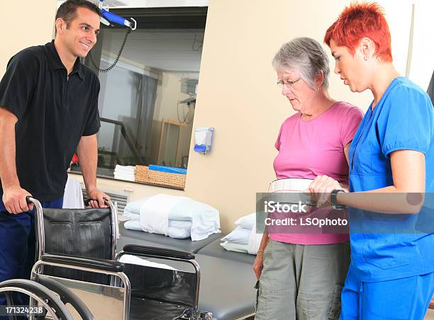 Physiotherapy Help Senior Stock Photo - Download Image Now - 30-39 Years, 60-69 Years, Active Seniors