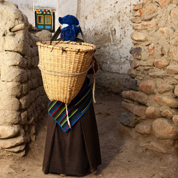 istock Tibetan woman carrying basket. 171324595