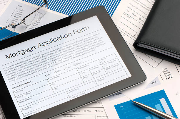 Online mortgage application form Online mortgage application form on a digital tablet mortgages and loans stock pictures, royalty-free photos & images