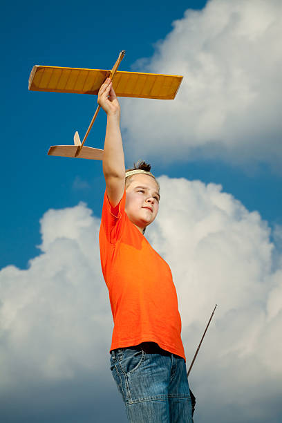 istock Little boy playing with airplane 171325011