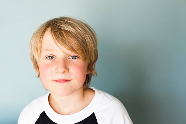 Content 9 Year Old Portrait of 9 year old boy.  Good copy space. 8 9 years stock pictures, royalty-free photos & images
