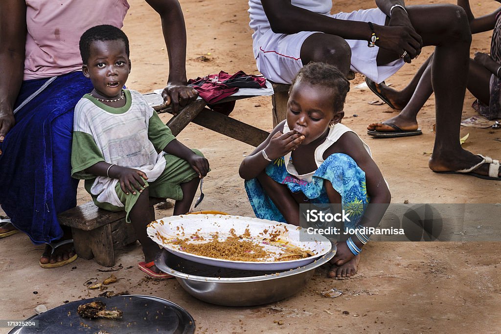 African food "Two African children eating rice in Ziguinchor's house, Senegal" Senegal Stock Photo