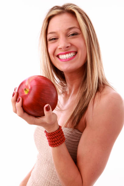 woman with big red apple