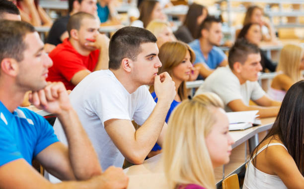 istock Large group of students listening to a lecture 171325248
