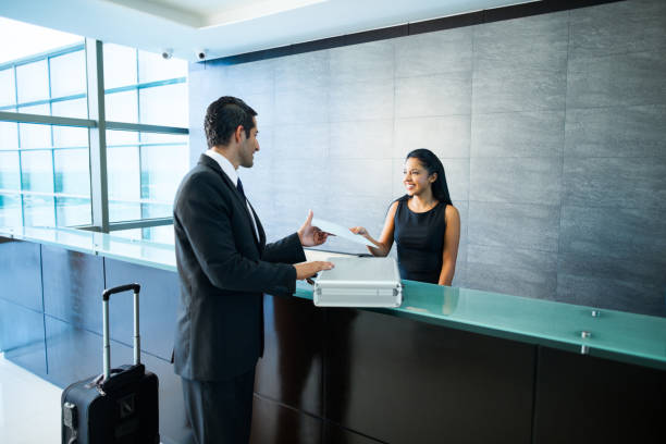 istock Business man in a lobby with receptionist 171325671