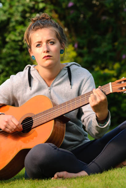 Young Woman Playing Guitar stock photo