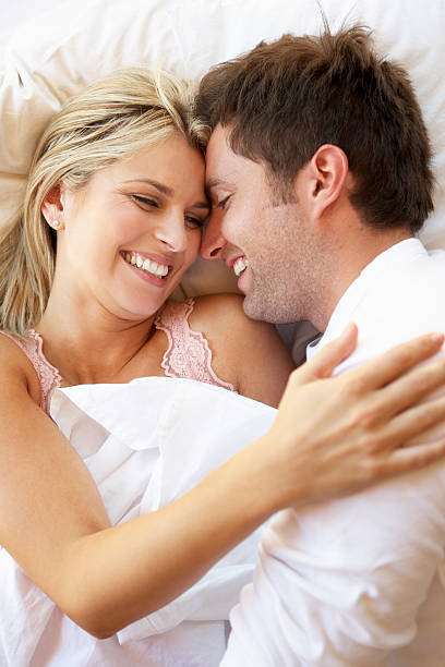 istock Couple Relaxing In Bed 171325812