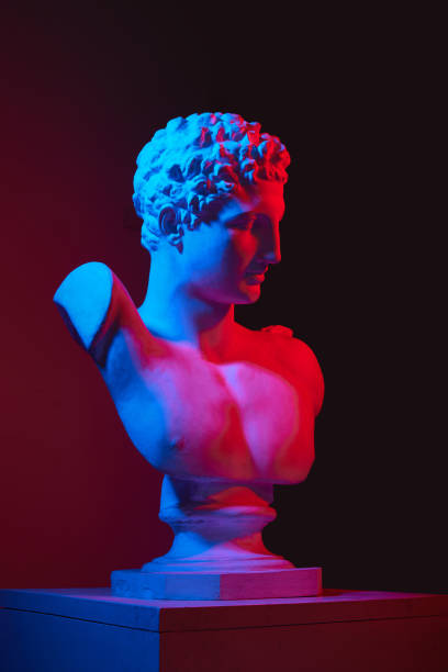 istock Plaster antique statue bust against gradient red studio background in neon lights. Concept of art and mythology 1713258990