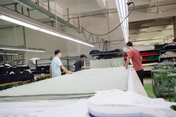 istock Cloth cutting worker in garment factory 1713260056