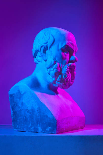 istock Male head. Antique statue bust against gradient purple studio background in neon lights. Concept of art and mythology 1713261657