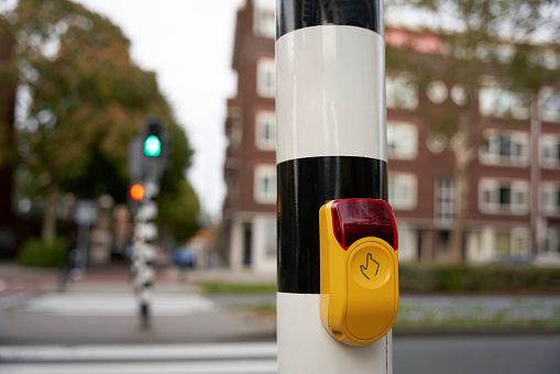 Close Up yellow crossing button on the street.