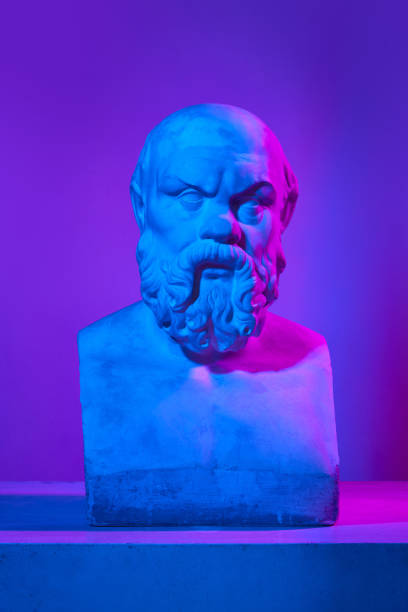 istock Male head. Antique statue bust against gradient purple studio background in neon lights. Concept of art and mythology 1713264332