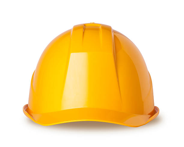 gelb schutzhelm auf weiss mit clipping path - bauarbeiterhelm stock-fotos und bilder