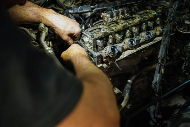 istock Mechanics repairing vehicle in garage 1713268641