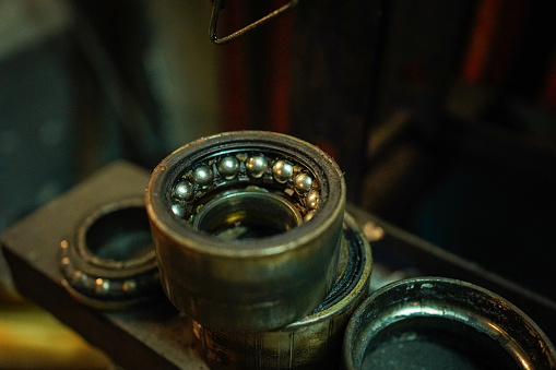 Close up shot of mechanical part in workshop