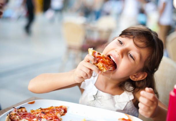 Little Girl Enjoying her Meal