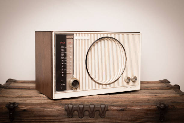 istock Vintage Beige Radio Sitting on Wood Table 171327113