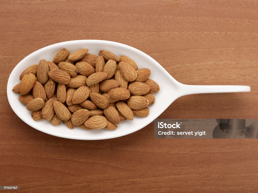 Roasted Almonds In A White Plate Acid Stock Photo