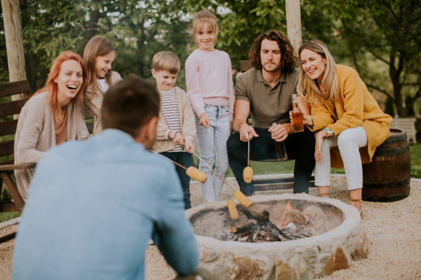 istock Friends having good time and baking corns in the house backyard 1713271681