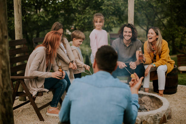 istock Friends having good time and baking corns in the house backyard 1713271724