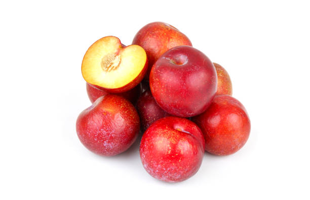 istock Heap of red plums isolated on white 1713273983
