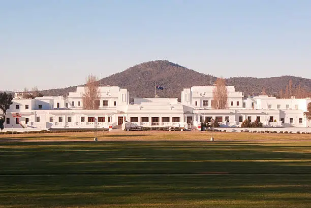 Old Parliament House, which currently serves as a museum, seen from Capital Hill on a late winter afternoon. Mt Ainslie is visible in the background.