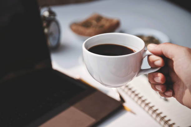 istock Coffee cup hot and using laptop working in the morning 1713279356