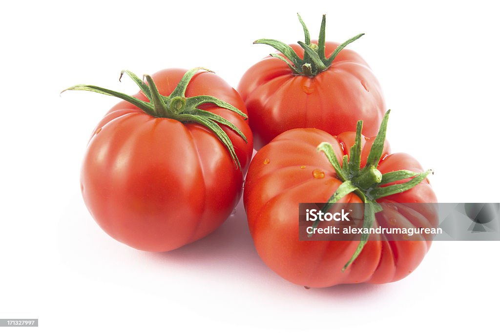 Organic Tomatoes Freshly Picked Organic Tomatoes over white background. Full Frame Camera and L Glass Used. XXL Image Cut Out Stock Photo