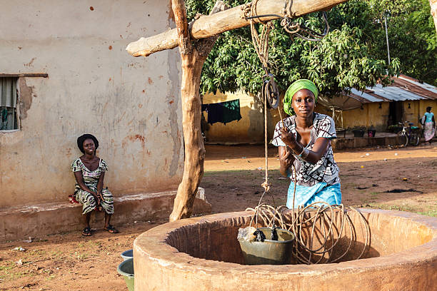 Water in africa Two African women extracting water of a well in Ziguinchor's city, Senegal senegal photos stock pictures, royalty-free photos & images