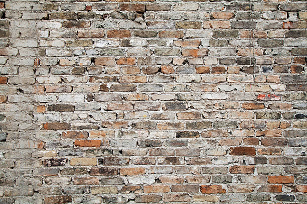 vecchio sfondo di muro di mattoni - brick wall old brick wall foto e immagini stock