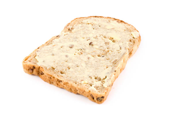 istock Wholemeal brown bread with butter on a white background 171329816