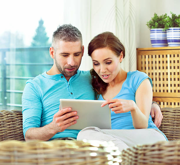 istock Adult Couple with digital tablet 171329829