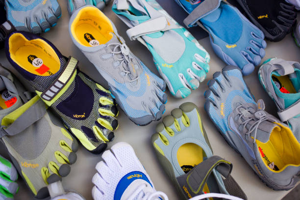 vibram zapatos de cinco dedos - multi colored sports shoe horizontal editorial fotografías e imágenes de stock