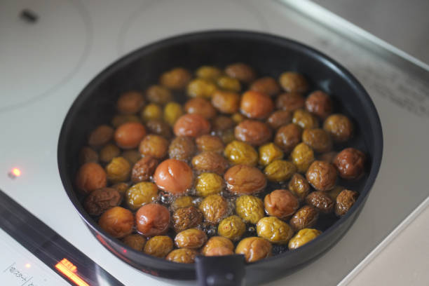 istock Boiling plum fruits removed from plum syrup 1713302454