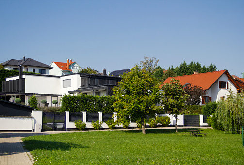 Pilisvorosvar - Werischwar, Pest County, Hungary, Europe - August 20, 2023 - Szent Istvan Park Blue Sky Summer Townscape, Rural Modern Urban Residential Area with Public Park, View from Levoca Street, Hungarian-German Bilingual Town, Northern Hungary, Central and Eastern Europe