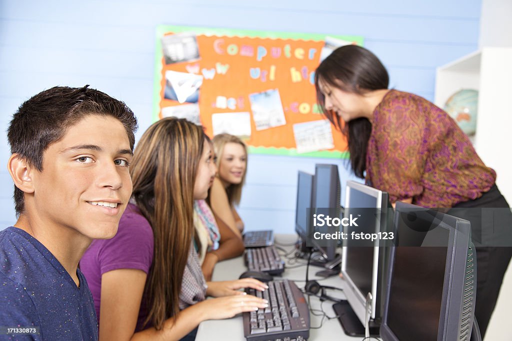 High School students in computer lab with instructor Teen students in computer lab.  MORE LIKE THIS... in lightboxes below! 30-39 Years Stock Photo