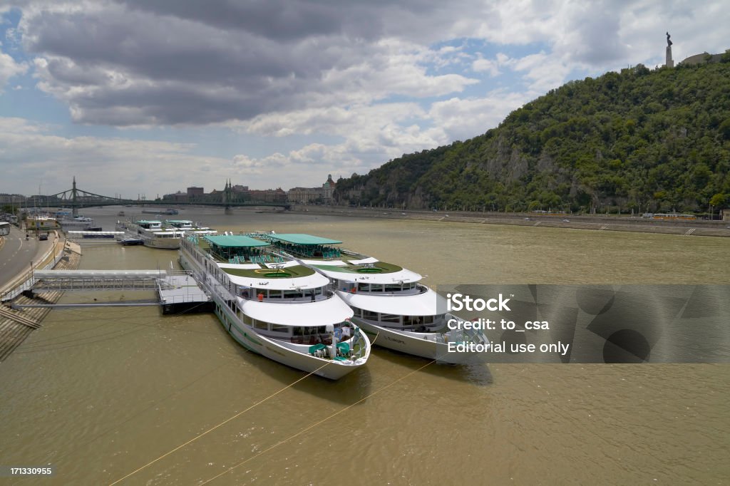 Cruise ships "Budapest, Hungary - June 26, 2012: Cruise ships at Budapest on the Danube river. A cruise ship or cruise liner is a passenger ship used for pleasure voyages, where the voyage itself and the ship's amenities are part of the experience, as well as the different destinations along the way." Budapest Stock Photo