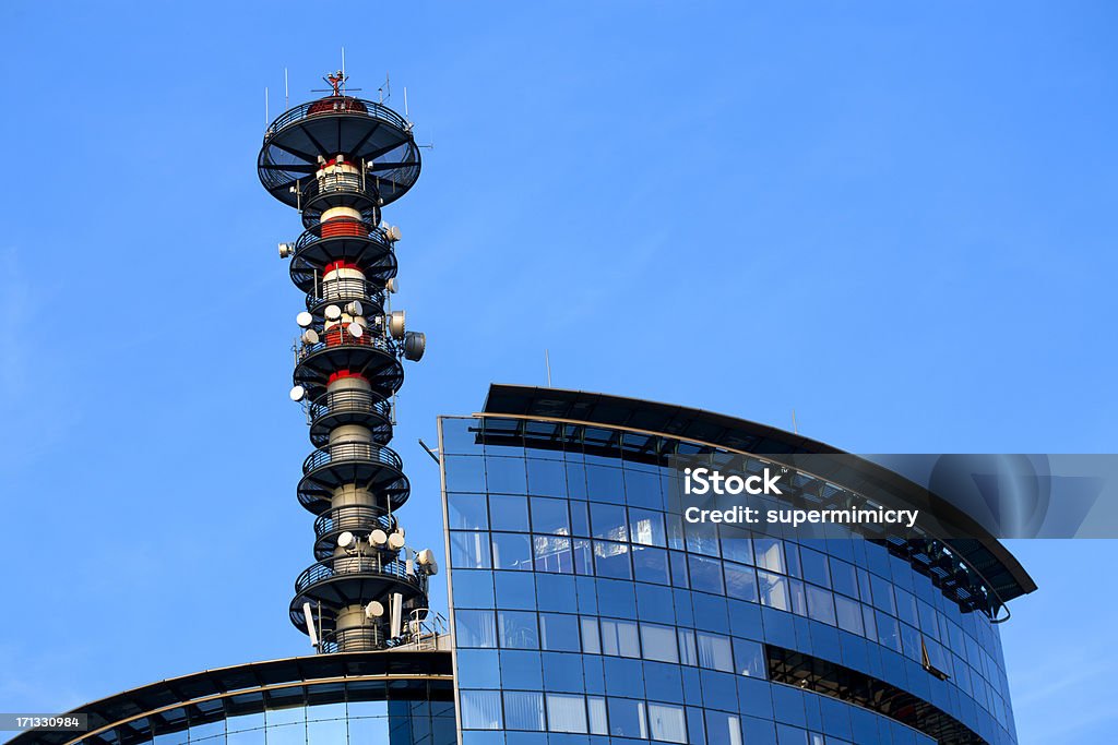 Broadcasting antenna Office Building with broadcasting antenna Air Pollution Stock Photo