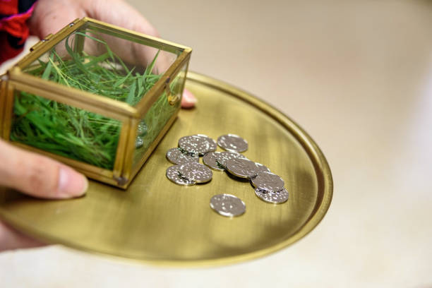 Traditional marriage earnest money, silver coins during a wedding celebration.